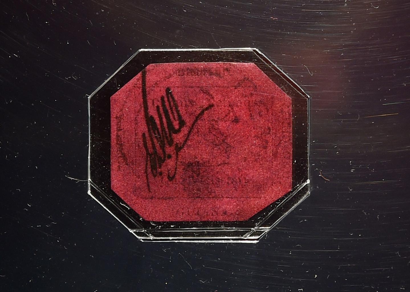 British Guiana 1856 one-cent magenta stamp in protective clear octagonal case, the world's rarest and most valuable postage stamp, unique worldwide